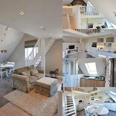 a kitchen and a living room with a couch and a staircase at Villa71 in Rijkevorsel