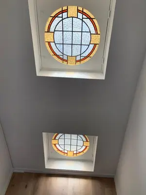 a room with two stained glass windows on the ceiling at #2800ourhome 201 in Mechelen