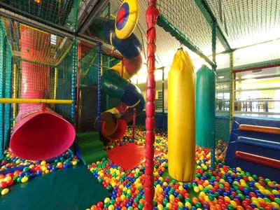 a playground with a bunch of balls and slides at Vakantiepark Breebos: Empty Lots for tents and mobile homes in Rijkevorsel