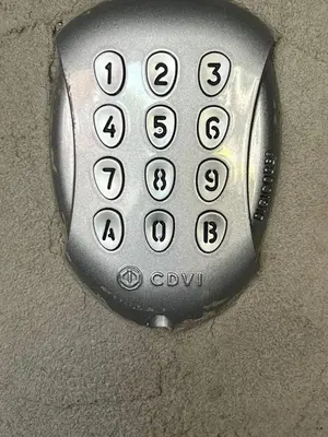 a close up of a remote control with numbers on it at K&Y suites 2 Brussels airport 500m! in Zaventem