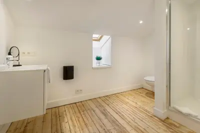 a bathroom with a shower and a sink and a toilet at Our Bird's Nest in the Heart of Antwerp in Antwerp