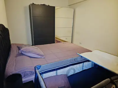 a small room with a bed and a cabinet at Luxurious 3 in Brussels