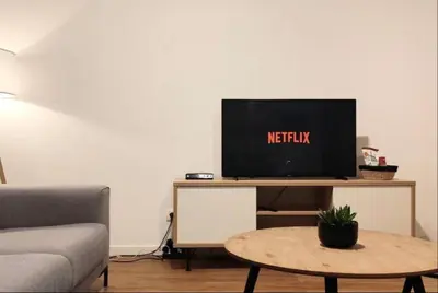 a living room with a tv on a table at 2 Bedroom Apartment in Center with Breathtaking View in Brussels
