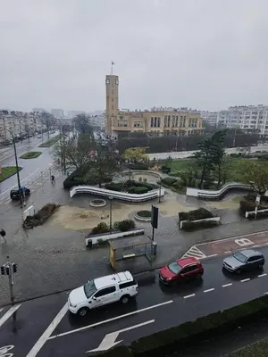 a city street with cars parked in a parking lot at Luxurious 4 in Brussels