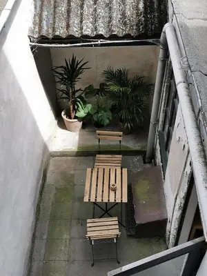 an overhead view of two benches and potted plants at Spacious room in city centre in Ghent