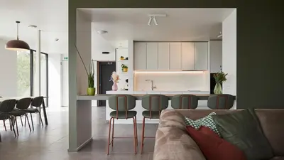 a kitchen and living room with a table and chairs at Het Kasterhuis in Wetteren