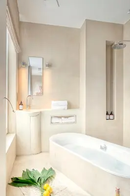 a white bathroom with a tub and a sink at Historic Ghent Building - Ideal Studio Retreat in Ghent