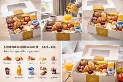 a box of breakfast baskets with breakfast foods and orange juice at KYOTO SUITES - Antwerp in Antwerp