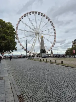 a large ferris wheel on a city street at Elegant apartment in center of Brussels in Brussels