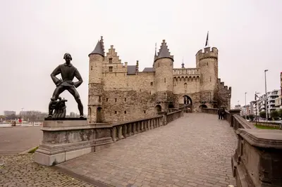 a statue of a man in front of a castle at SHWAY - The Seaman's Sight in Antwerp