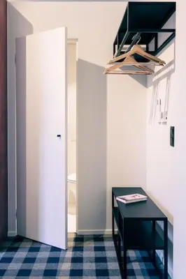 a room with a black table and a white door at Studio Retreat in the Centre of Ghent in Ghent