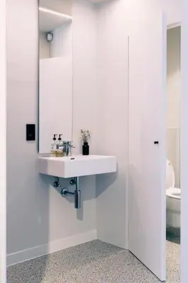 a white bathroom with a sink and a toilet at Studio for 2 in City of Ghent in Ghent