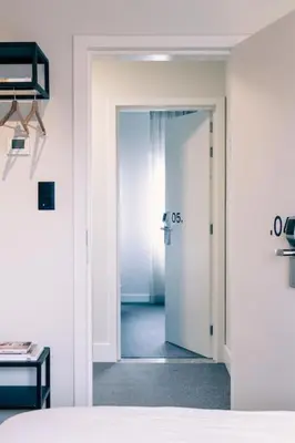 a room with a door leading to a bedroom at Cozy Studio for Two in Central Ghent in Ghent