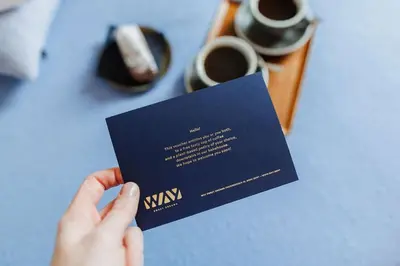 a person holding a visa card on a table at Cozy Studio for Two in Central Ghent in Ghent