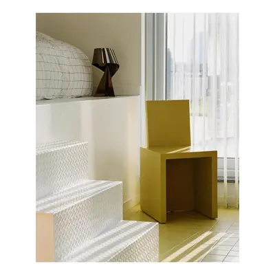 a room with a bed and a table with a box at Garden flat in central brussels in Brussels