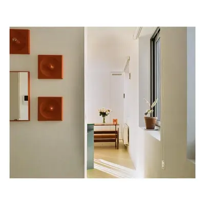two pictures of a hallway with a table and a mirror at Garden flat in central brussels in Brussels