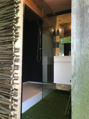 a bathroom with a shower with a glass door at Memories in Assenede