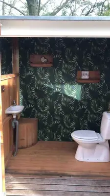 a bathroom with a toilet and a sink at Memories in Assenede