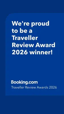 a blue sign that says were proud to be a traveller reviewagency winner at The Beautiful White Villa in Kortenberg