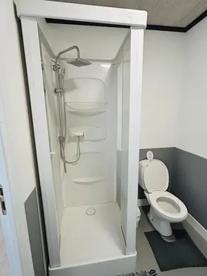 a bathroom with a shower and a toilet at The Nest In Leuven - Family Friendly Room in Leuven