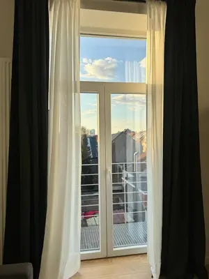 a window with a view of a balcony at Loft Luna Brussels Midi in Brussels