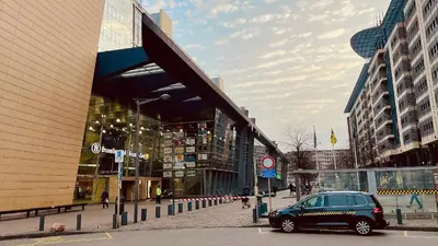 a car parked on a street in front of a building at Midi Station 2 in Brussels