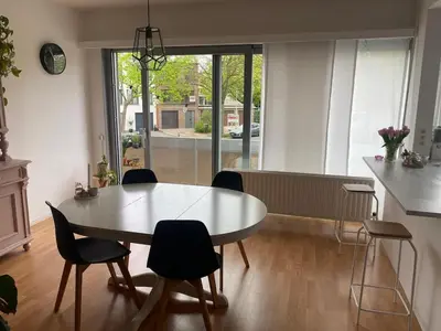 a kitchen with a table and chairs in a room at Perfect for Tomorrowland in Edegem