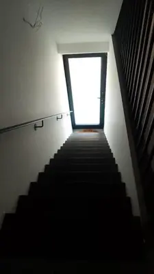 a stairway leading up to a window in a building at Apartment Boom 200m from centrm in Boom
