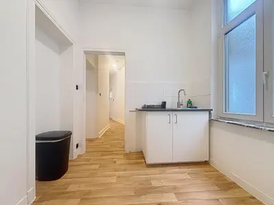 a kitchen with a sink and a counter in a room at Basilique Brussels 2 in Brussels