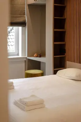 a bedroom with a bed with two towels on it at Bellavista Luxe Apartment with Leie View in Ghent