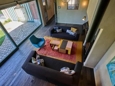 an overhead view of a living room with couches and a table at Lactea in Schilde