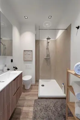 a bathroom with a shower and a toilet and a sink at Modern 2-Bedroom Apartment for 4 Guests, In a Prime Location Close to the Train Station and the Historic Center of Ghent in Ghent
