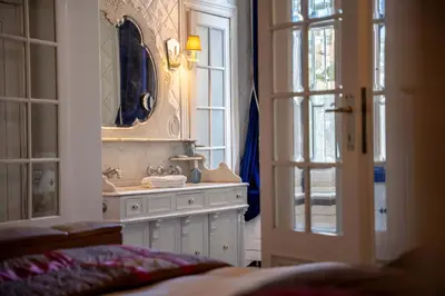a bathroom with a sink and a mirror at Papillon Boutique Villa Centre Antwerp in Antwerp