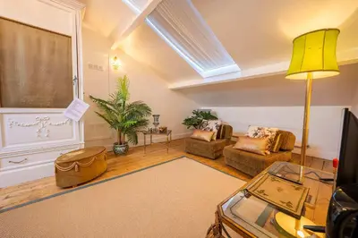 a living room with a couch and a table at Papillon Boutique Villa Centre Antwerp in Antwerp