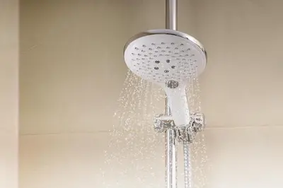 a shower head with water coming out of it at NH Collection Antwerp Centre in Antwerp