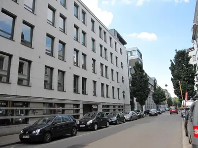 a row of cars parked in front of a building at Modern Apartment First Floor in Brussels