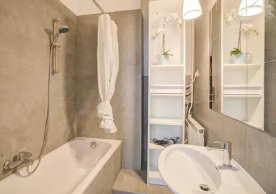 a bathroom with a tub and a sink and a shower at Theodore Residence in the Heart of Antwerp in Antwerp