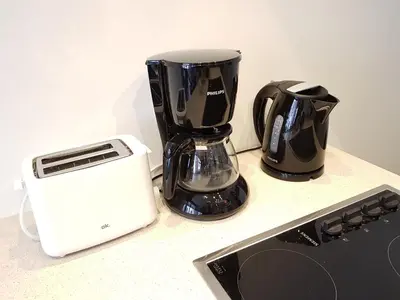 a blender and a toaster sitting on a counter at Theodore Residence in the Heart of Antwerp in Antwerp