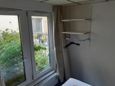 a corner of a room with a window and a shelf at casa di Claudia in Antwerp