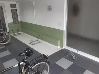 a bike parked in a room with a tiled floor at casa di Claudia in Antwerp