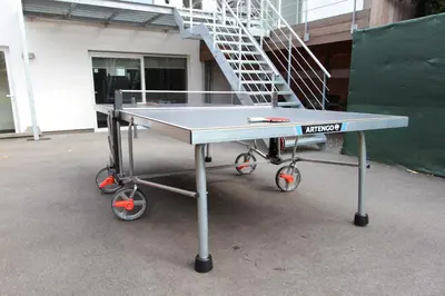 a ping pong table in front of a building at NUVOLA HOUSE in Zottegem
