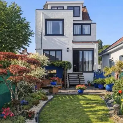 a house with a garden in front of it at Spacious Villa in Dilbeek with Private Garden, Ideal for Families & Business in Dilbeek